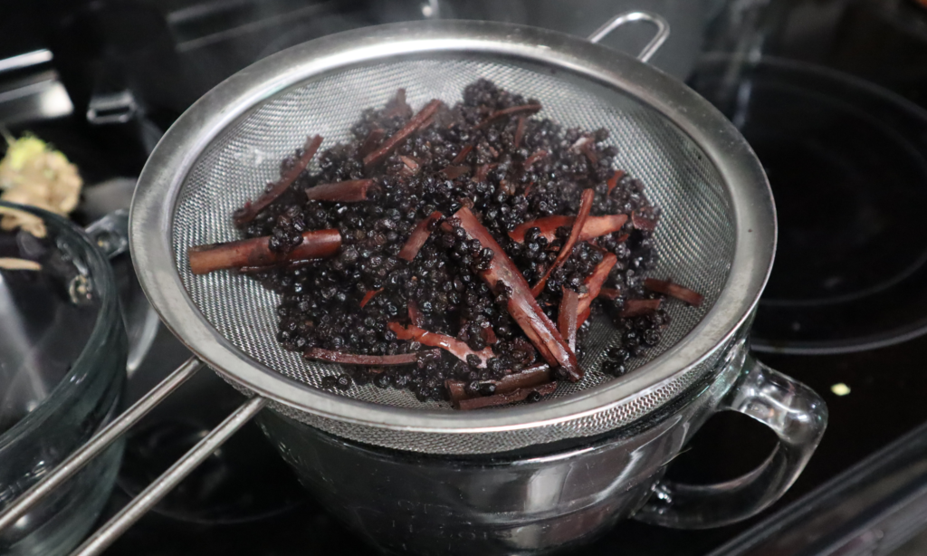 Let the liquid cool off for a bit before pouring into a strainer, over the glass bowl. 